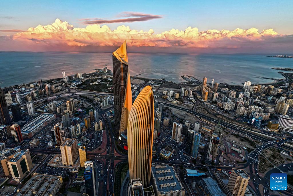 A drone photo taken on Dec. 17, 2025 shows a city view with clouds rolling over Kuwait City, Kuwait. (Photo by Asad/Xinhua)