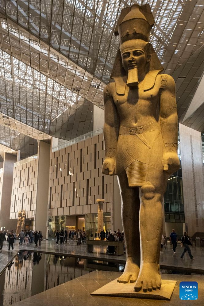 This photo taken on Dec. 20, 2025 shows the Colossal Statue of Ramesses II at the Grand Egyptian Museum in Giza, Egypt. The Grand Egyptian Museum (GEM) opened its doors to the public on Nov. 4, establishing itself as one of the world's largest displays of ancient relics, and a high-tech fort dedicated to heritage conservation.

The main galleries display thousands of previously stored antiquities for the first time, housing the complete collection of some 5,992 artifacts from the tomb of the boy-king Tutankhamun. (Xinhua/Xin Mengchen)