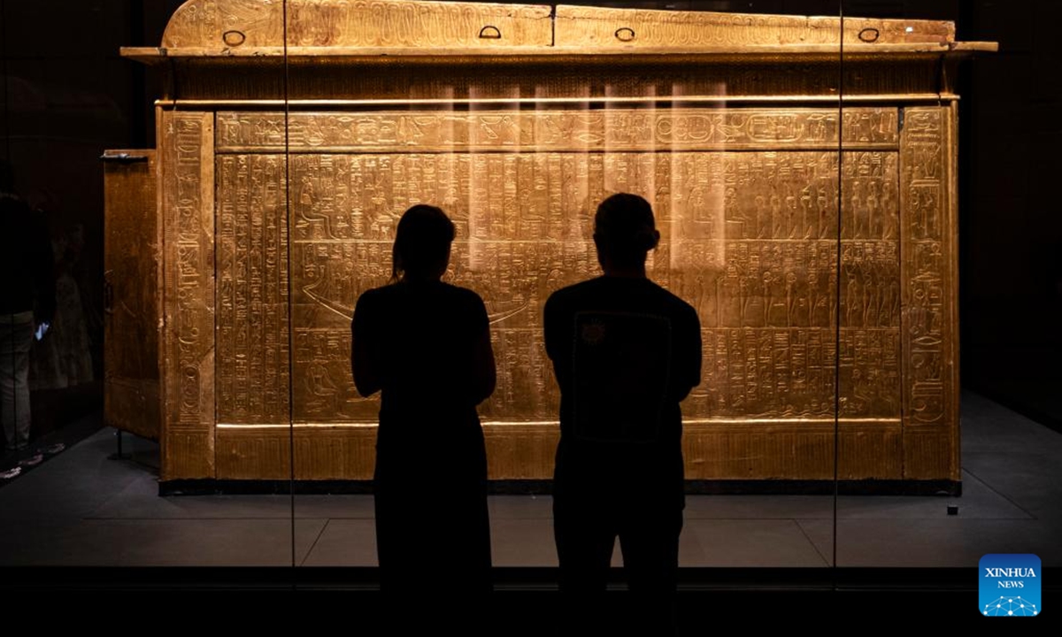 People view a shrine of Tutankhamun at the King Tutankhamun exhibition hall of the Grand Egyptian Museum in Giza, Egypt, on Dec. 20, 2025. The Grand Egyptian Museum (GEM) opened its doors to the public on Nov. 4, establishing itself as one of the world's largest displays of ancient relics, and a high-tech fort dedicated to heritage conservation.

The main galleries display thousands of previously stored antiquities for the first time, housing the complete collection of some 5,992 artifacts from the tomb of the boy-king Tutankhamun. (Xinhua/Xin Mengchen)