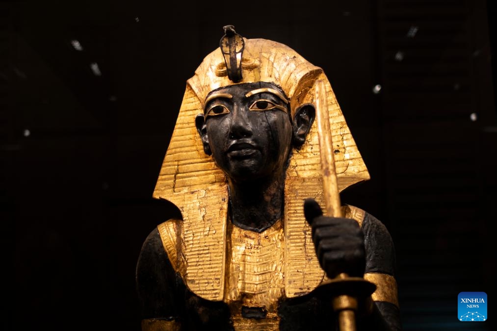 This photo taken on Dec. 20, 2025 shows the Guardian Statue with Nemes Headcloth at the King Tutankhamun exhibition hall of the Grand Egyptian Museum in Giza, Egypt. The Grand Egyptian Museum (GEM) opened its doors to the public on Nov. 4, establishing itself as one of the world's largest displays of ancient relics, and a high-tech fort dedicated to heritage conservation.

The main galleries display thousands of previously stored antiquities for the first time, housing the complete collection of some 5,992 artifacts from the tomb of the boy-king Tutankhamun. (Xinhua/Xin Mengchen)