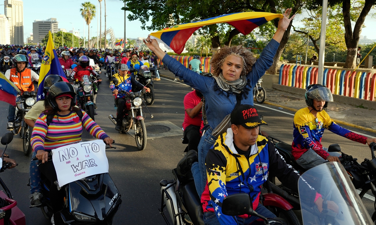 Venezuelan government supporters ride motorbikes through Caracas, Venezuela on local time December 22, 2025, to protest US interference as the two countries' row is escalating. Photo: VCG