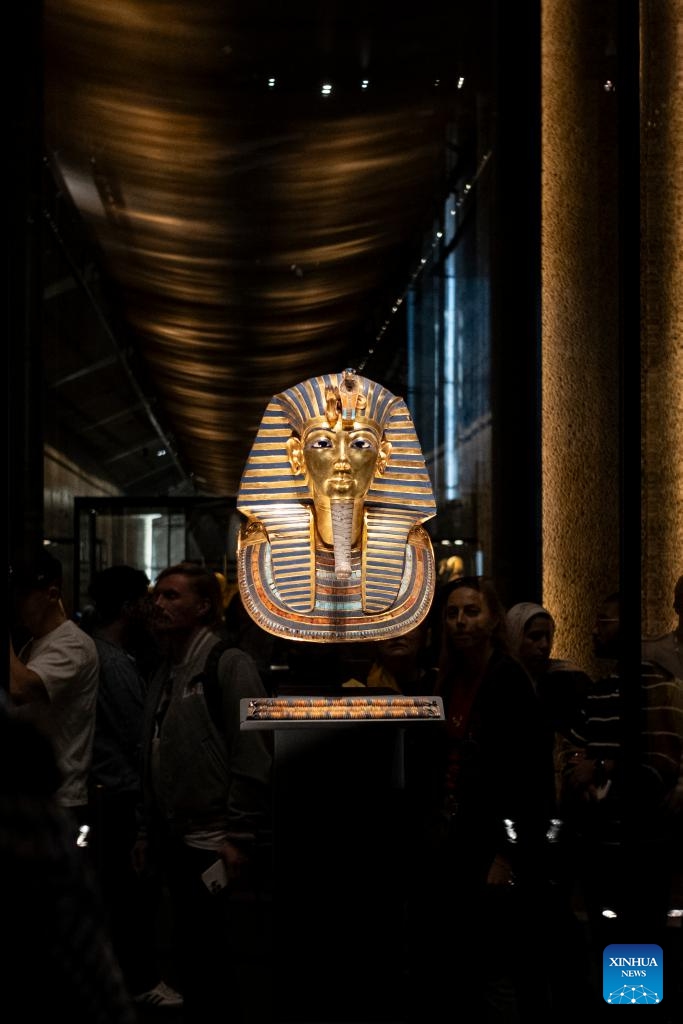 This photo taken on Dec. 20, 2025 shows the Golden Burial Mask of Tutankhamun at the King Tutankhamun exhibition hall of the Grand Egyptian Museum in Giza, Egypt. The Grand Egyptian Museum (GEM) opened its doors to the public on Nov. 4, establishing itself as one of the world's largest displays of ancient relics, and a high-tech fort dedicated to heritage conservation.

The main galleries display thousands of previously stored antiquities for the first time, housing the complete collection of some 5,992 artifacts from the tomb of the boy-king Tutankhamun. (Xinhua/Xin Mengchen)