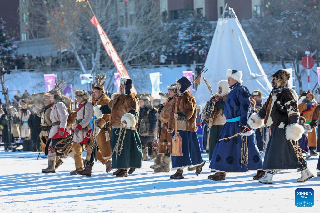 A folk performance is staged during the opening ceremony of the 21st Ice and Snow Nadam Fair of the Inner Mongolia Autonomous Region in Hailar District of Hulun Buir, north China's Inner Mongolia Autonomous Region, Dec. 21, 2025. The nadam fair kicked off here on Sunday, attracting tourists from home and abroad. (Photo by Kang Wenkui/Xinhua)