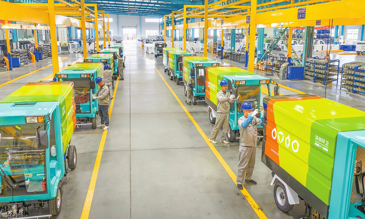 Workers assemble new-energy electric street sweepers at Anhui Airite New Energy Special Vehicle Co in Wuhu, East China's Anhui Province, on December 22, 2025. As the year-end approaches, many enterprises in Wuhu's Fanchang district are operating at full capacity to meet annual targets and fulfill orders. Photo: VCG