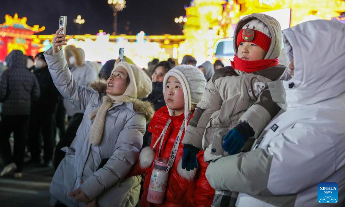 Tourists visit a light festival in Horqin Right Wing Front Banner, Hinggan League, north China's Inner Mongolia Autonomous Region, Dec. 20, 2025. A light festival kicked off here on Saturday, attracting many people to come and enjoy various illuminated installations. (Xinhua)