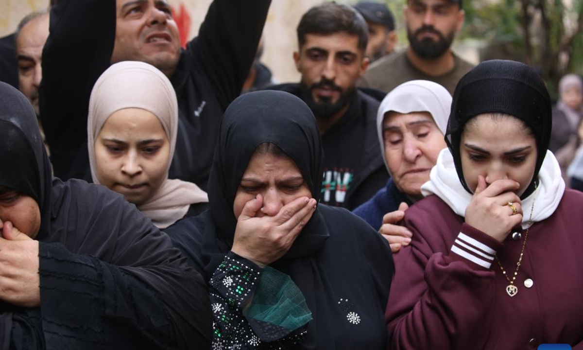 Palestinians mourn during the funeral of a 22-year-old man, Ahmed Said Zayoud, in the town of Silat al-Harithiya, northwest of the West Bank city of Jenin, Dec. 21, 2025. Two Palestinians were killed by Israeli forces in separate incidents in the northern West Bank on Saturday, the Palestinian Ministry of Health said. According to the ministry in Ramallah, a 16-year-old, Rayan Mohammed Abdel Qader Abu Mualla, was killed in Qabatiya. His body is being withheld by Israeli forces, the statement added. (Photo by Nidal Eshtayeh/Xinhua)