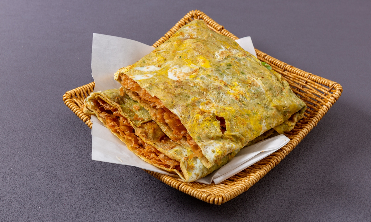 Jianbing guozi, a savory pancake roll filled with crispy fried dough sticks  Photo: VCG