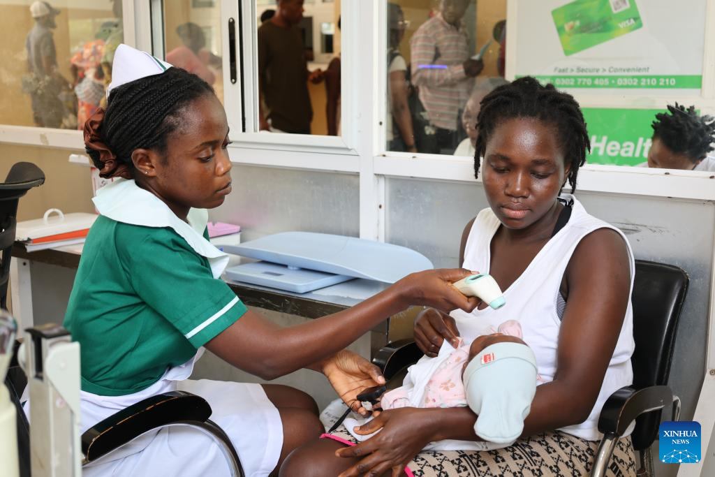 A nurse conducts a medical checkup for a baby at the China-Ghana Friendship Hospital in Accra, the capital of Ghana, Dec. 23, 2025. The hospital, also known as Lekma Hospital, on Tuesday marked the 15th anniversary of its establishment here.(Photo by Seth/Xinhua)