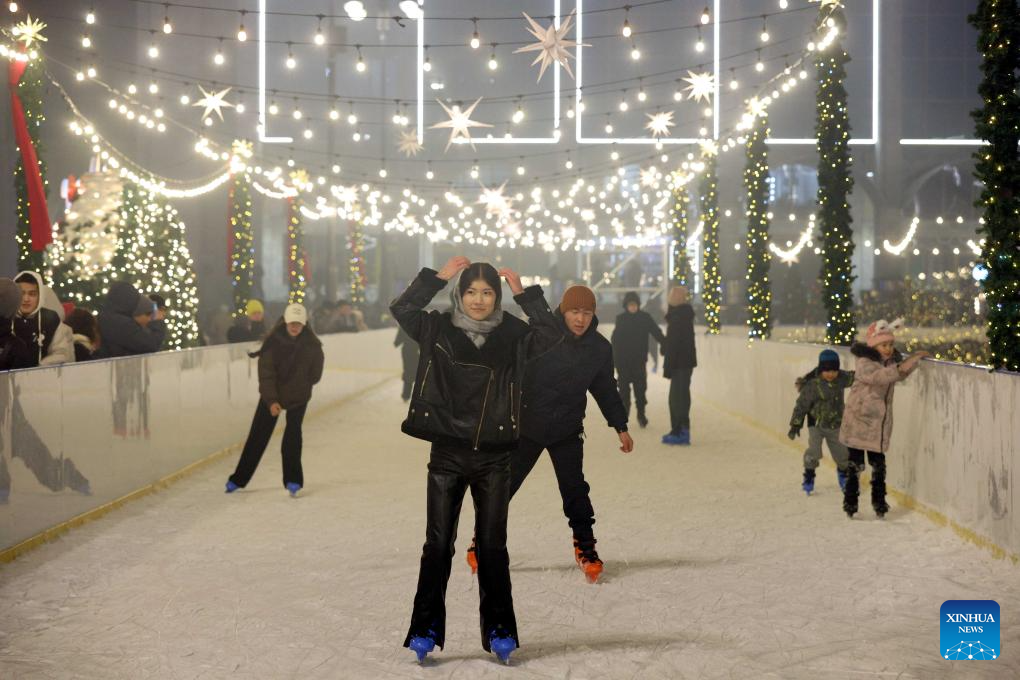 People skate at the Ala-Too Square during a New Year event in Bishkek, Kyrgyzstan, Dec. 23, 2025. (Photo by Roman/Xinhua)