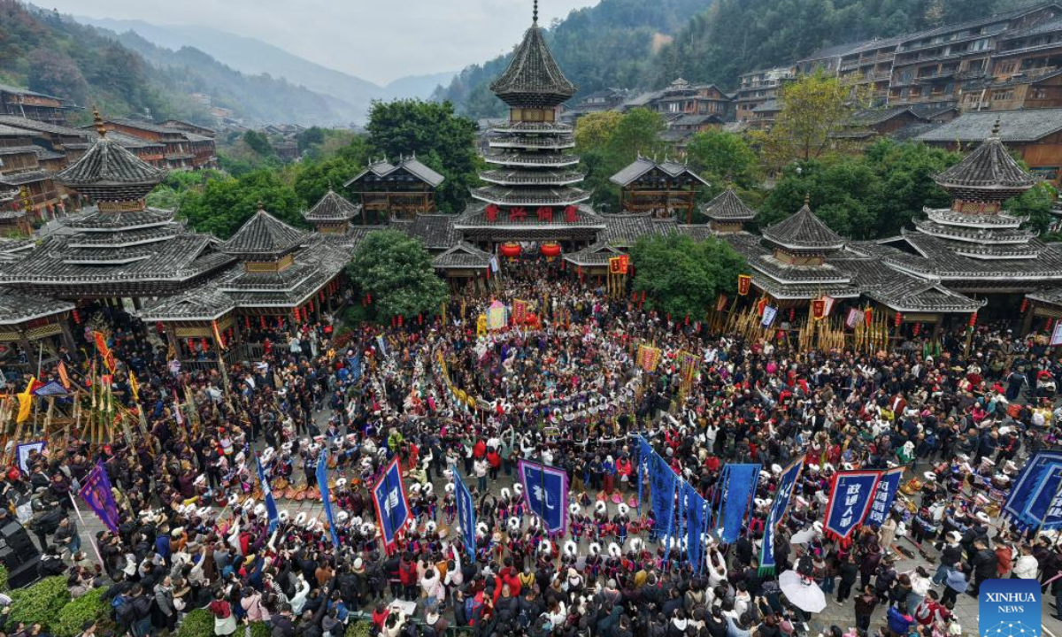 A drone photo taken on Dec. 20, 2025 shows people celebrating the annual Dong New Year festival in Zhaoxing Dong village of Liping County, Qiandongnan Miao and Dong Autonomous Prefecture, southwest China's Guizhou Province. (Photo by Long Jianrui/Xinhua)