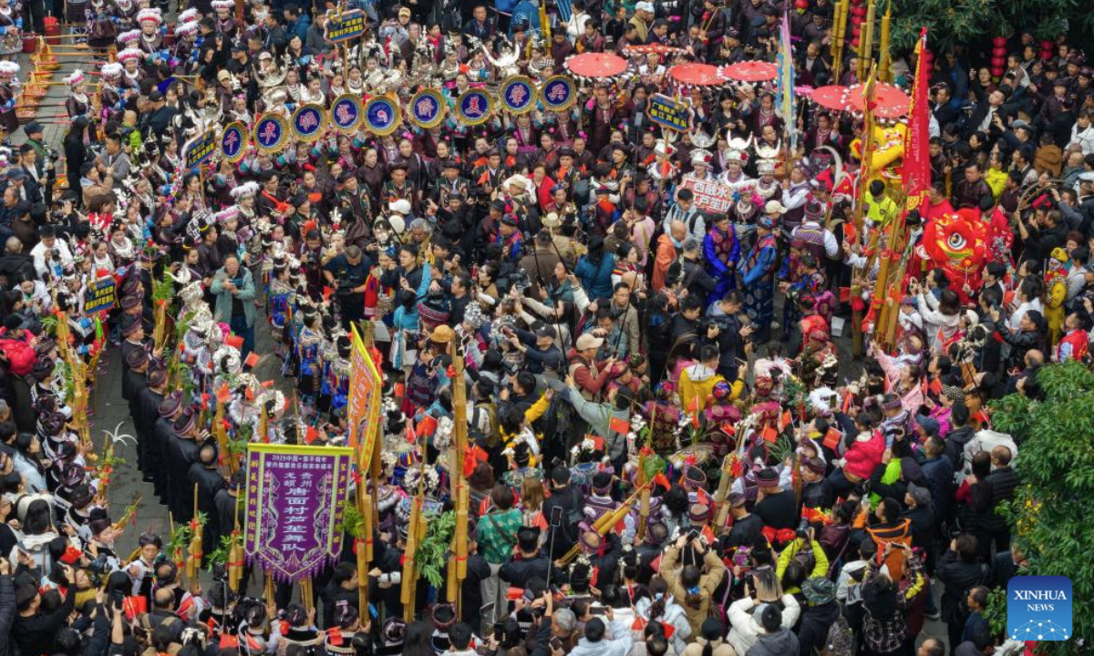 A drone photo taken on Dec. 20, 2025 shows people celebrating the annual Dong New Year festival in Zhaoxing Dong village of Liping County, Qiandongnan Miao and Dong Autonomous Prefecture, southwest China's Guizhou Province. (Photo by Long Jianrui/Xinhua)