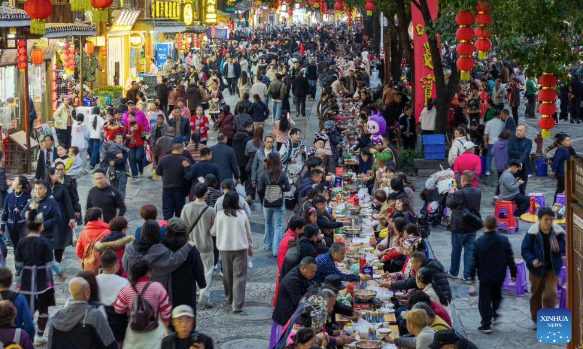 A long-table banquet is held to celebrate the annual Dong New Year festival in Zhaoxing Dong village of Liping County, Qiandongnan Miao and Dong Autonomous Prefecture, southwest China's Guizhou Province, Dec. 20, 2025. (Photo by Long Jianrui/Xinhua)