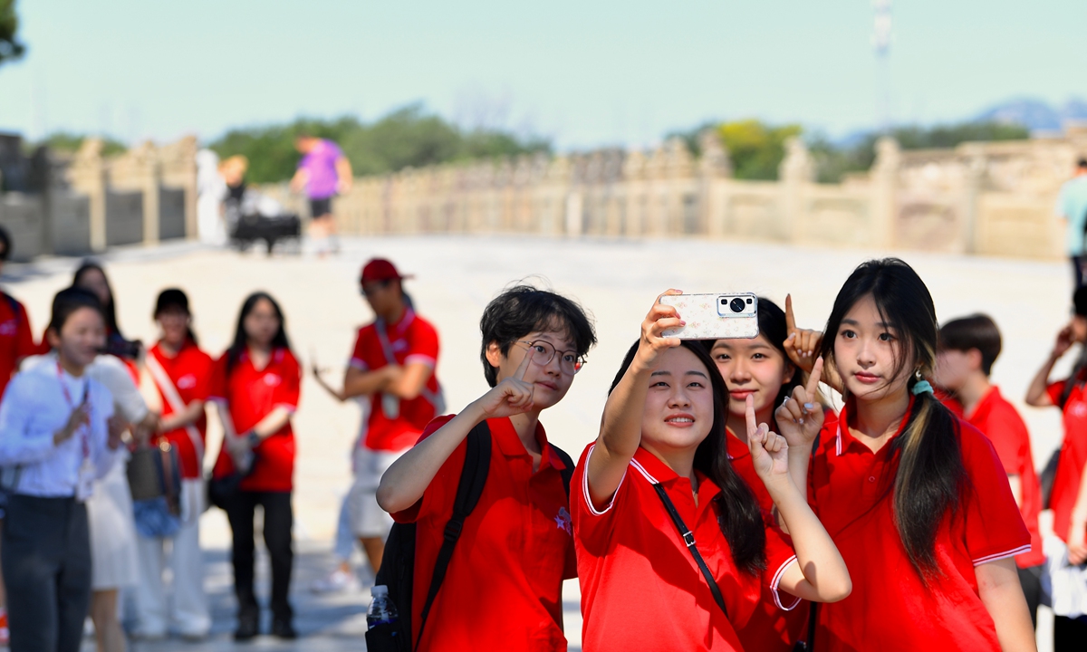 University students from Hong Kong take a selfie together while participating in a summer exchange program in Beijing on July 30, 2025. Photo: VCG