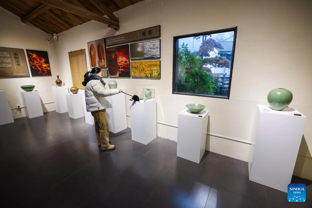 Porcelains are displayed at a porcelain art workshop in an art village in Kuangyan Town, Cixi City, east China's Zhejiang Province, Dec. 24, 2025. In recent years, Kuangyan Town has built an art village integrated with cultural tourism to develop local rural industries and promote rural revitalization. (Xinhua/Xu Yu)