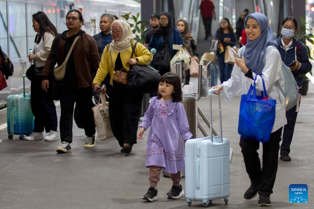 Passengers are pictured at Bandung train station in Bandung, West Java, Indonesia, Dec. 24, 2025. Indonesia is and will be witnessing holiday travel rush during Christmas and New Year, which coincides with the country's school holiday season. (Photo by Septianjar Muharam/Xinhua)