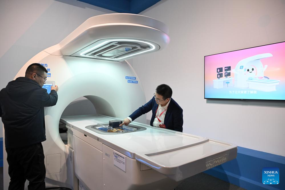 This photo taken on Dec. 29, 2025 shows a cancer treatment system at the exhibition Forging the Path to National Strength: China's Manufacturing Achievements under the 14th Five-Year Plan at the National Museum of China in Beijing, capital of China. With more than 300 pieces (sets) exhibits, the exhibition kicked off here on Monday, showcasing China's manufacturing achievements under the 14th Five-Year Plan. (Xinhua/Jin Liangkuai)