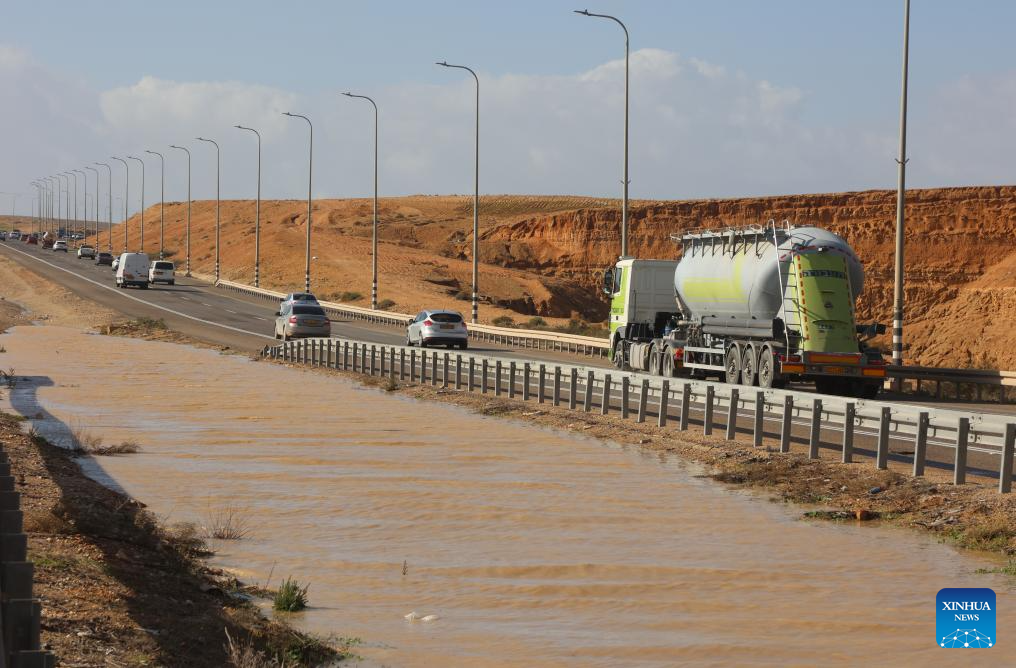 This photo taken on Dec. 28, 2025 shows floodwater accumulating alongside a highway in southern Israel. Israel's winter rainy season frequently brings floods. (Photo by Gil Cohen Magen/Xinhua)