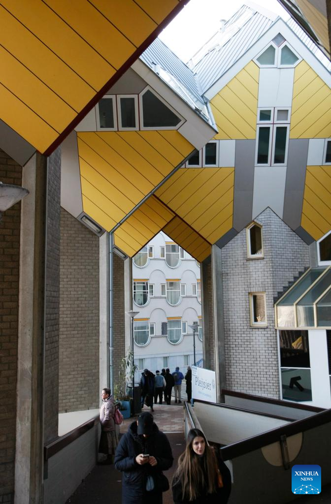 This photo taken on Dec. 28, 2025 shows the cube houses in Rotterdam, the Netherlands. The cube houses, designed by Dutch architect Piet Blom, were built in the 1980s. A total of 38 cube houses resemble an interconnected Rubik's Cube and have become a distinctive architectural landmark in Rotterdam. (Xinhua/Shao Haijun)