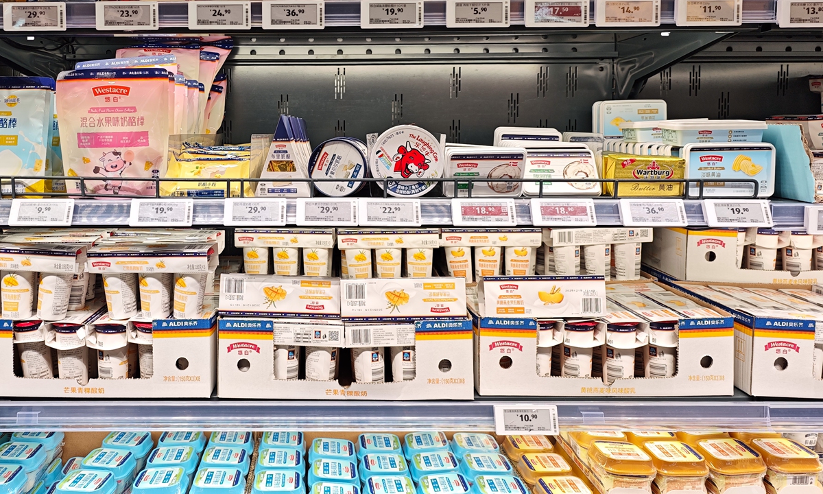 Various imported and domestic dairy products display on the shelves of a European-brand supermarket in Shanghai, on December 26, 2025. Photo: VCG