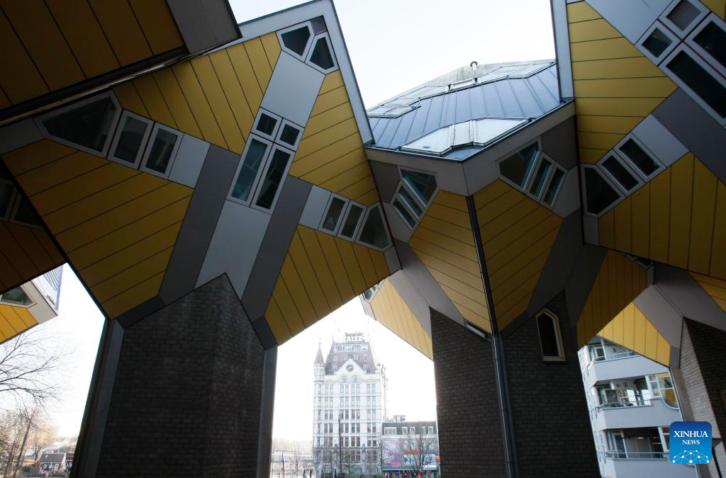 This photo taken on Dec. 28, 2025 shows the cube houses in Rotterdam, the Netherlands. The cube houses, designed by Dutch architect Piet Blom, were built in the 1980s. A total of 38 cube houses resemble an interconnected Rubik's Cube and have become a distinctive architectural landmark in Rotterdam. (Xinhua/Shao Haijun)