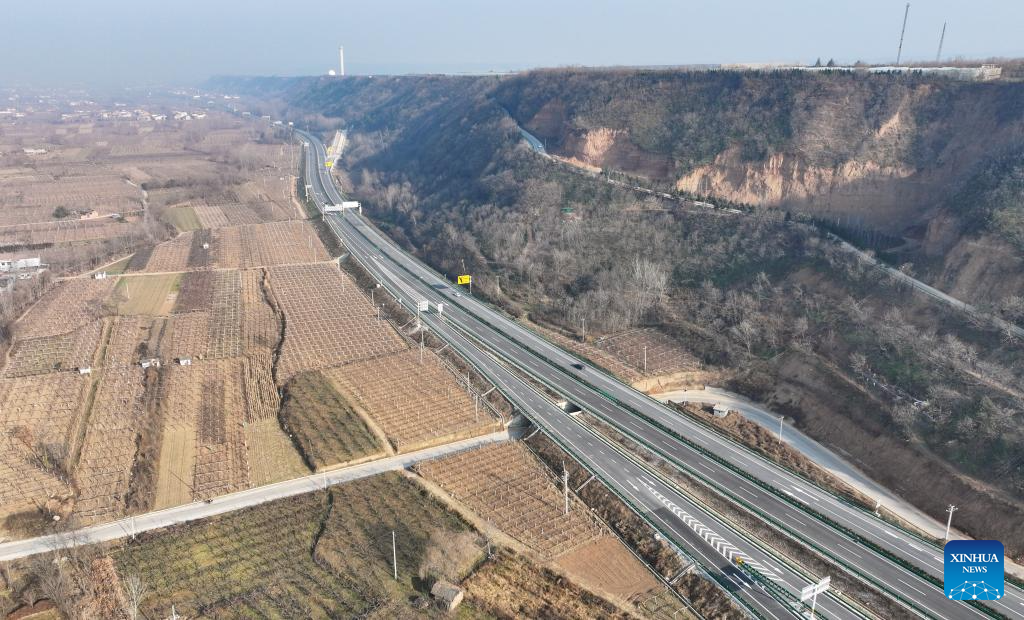 This aerial drone photo taken on Dec. 29, 2025 shows a section of the expressway linking Meixian County and Taibai County in northwest China's Shaanxi Province. The 75-km-long expressway linking Meixian County and Taibai County in Shaanxi started operation on Monday. (Xinhua/Zhang Bowen)