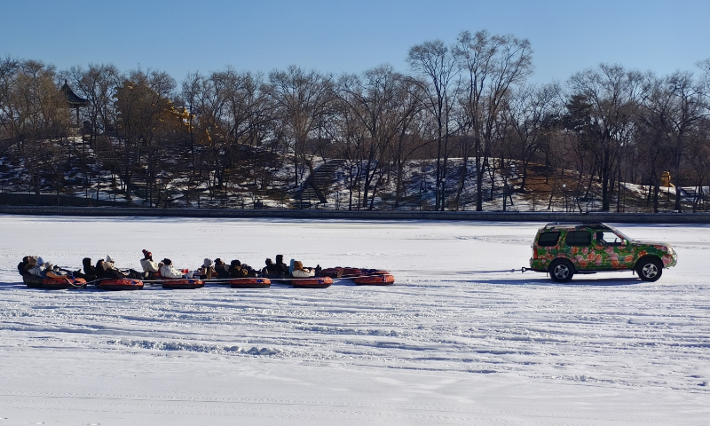 Tourists enjoy ice-and-snow sports on a frozen lake in Shenyang, Northeast China's Liaoning Province, on December 29, 2025. Shenyang has launched its winter tourism series, featuring more than 300 activities such as dragon boat races on ice. China's ice-and-snow economy is projected to reach 1.0053 trillion yuan ($140 billion) in 2025, according to the China Ice and Snow Industry Development Research Report. Photo: VCG