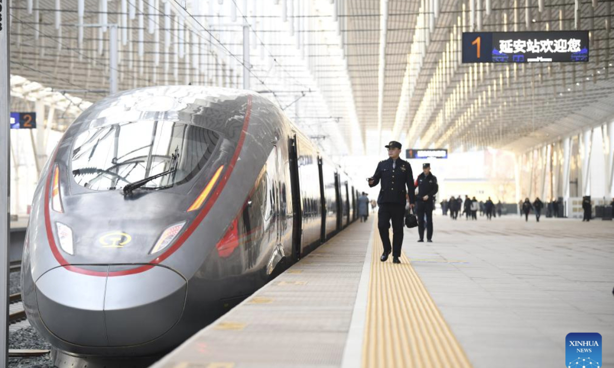 Staff members check the first train of the new Xi'an-Yan'an high-speed railway at Yan'an Station in Yan'an, northwest China's Shaanxi Province, Dec. 26, 2025. China, home to the world's largest high-speed rail network, has expanded its total operational mileage beyond 50,000 kilometers with the launch of the new Xi'an-Yan'an high-speed railway. (Xinhua/Zhang Bowen)