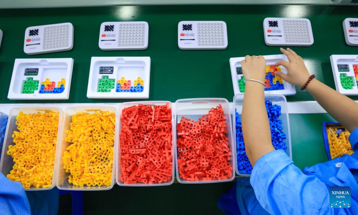 A worker works on the production line of Giiker in Shunde, Foshan City, south China's Guangdong Province, Oct. 29, 2025. As traditional toys are stuck in price and homogenization competition, a batch of smart educational toys is quietly opening up new markets at home and abroad.（Xinhua）