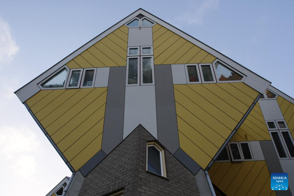 This photo taken on Dec. 28, 2025 shows the cube houses in Rotterdam, the Netherlands. The cube houses, designed by Dutch architect Piet Blom, were built in the 1980s. A total of 38 cube houses resemble an interconnected Rubik's Cube and have become a distinctive architectural landmark in Rotterdam. (Xinhua/Shao Haijun)