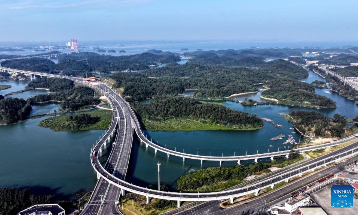 An aerial drone photo taken on Dec. 27, 2025 shows the winter scenery of the Maowei Sea in Qinzhou, south China's Guangxi Zhuang Autonomous Region. In winter, the Maowei Sea in Guangxi presents picturesque scenery. In recent years, Guangxi has implemented high-standard ecological protection of the marine environment in the Beibu Gulf, transforming the Maowei Sea into a new cultural and tourism landmark. (Xinhua/Zhang Ailin)