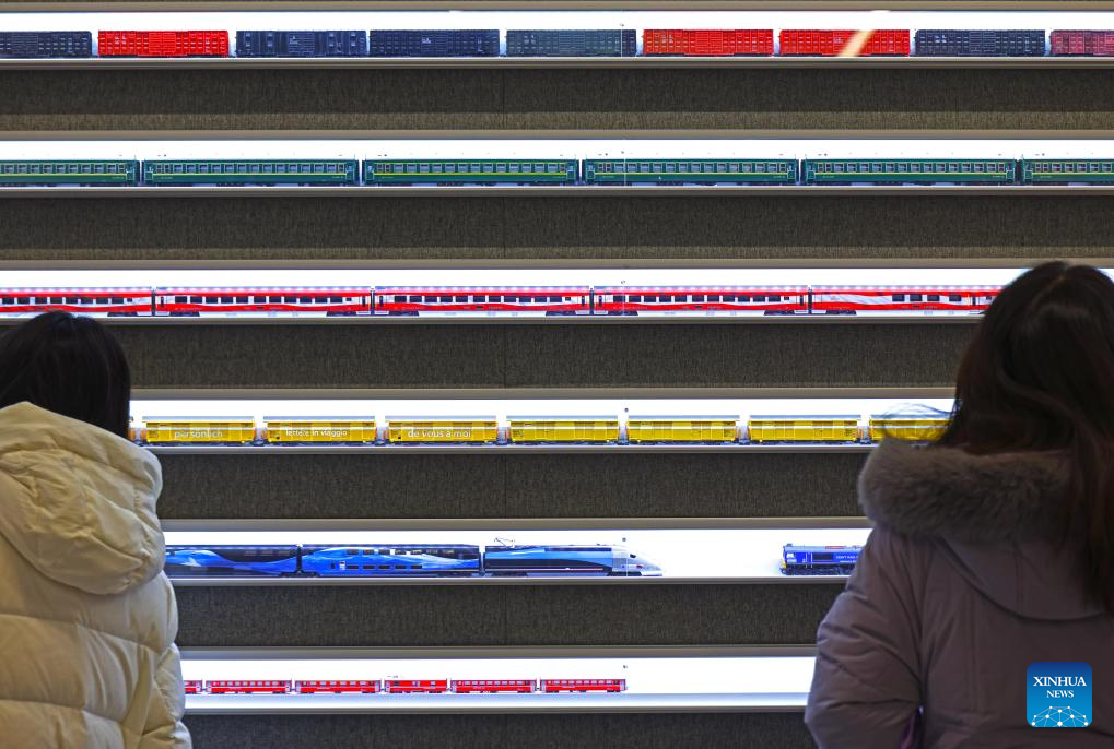 People visit a model train exhibition in Shanghai, east China, Dec. 27, 2025. The theme exhibition and related special activities were held at Shanghai Mass Art Center on Saturday. More than 50 model trains shuttled among ten theme scenes, presenting visitors with a wonderful miniature world about trains and railways. (Xinhua/Liu Ying)