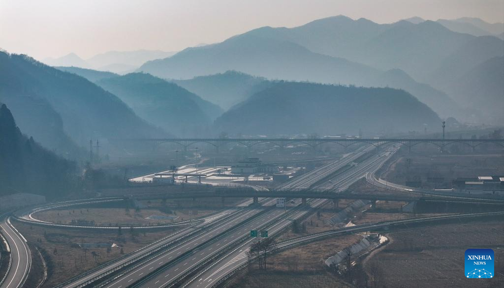 This aerial drone photo taken on Dec. 29, 2025 shows a section of the expressway linking Meixian County and Taibai County in northwest China's Shaanxi Province. The 75-km-long expressway linking Meixian County and Taibai County in Shaanxi started operation on Monday. (Xinhua/Zhang Bowen)