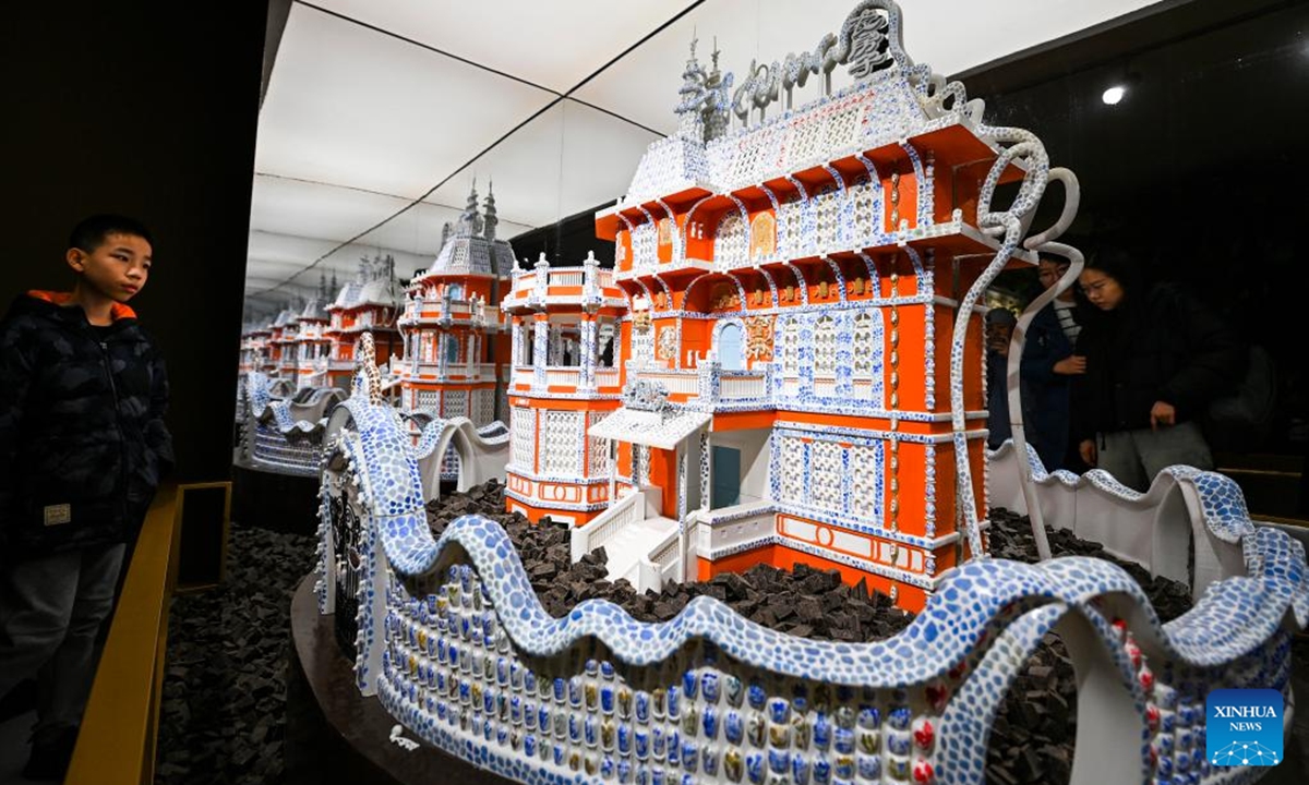 Tourists visit a chocolate museum in Tianjin, north China, Dec. 28, 2025. A chocolate museum has officially opened to the public in Tianjin. The museum displays more than 20 sets of handmade chocolate sculptures, with a total chocolate usage of nearly 10 tonnes. (Xinhua/Zhao Zishuo)