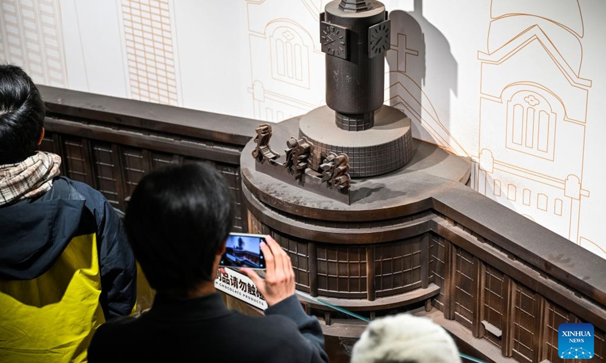 Tourists visit a chocolate museum in Tianjin, north China, Dec. 28, 2025. A chocolate museum has officially opened to the public in Tianjin. The museum displays more than 20 sets of handmade chocolate sculptures, with a total chocolate usage of nearly 10 tonnes. (Xinhua/Zhao Zishuo)