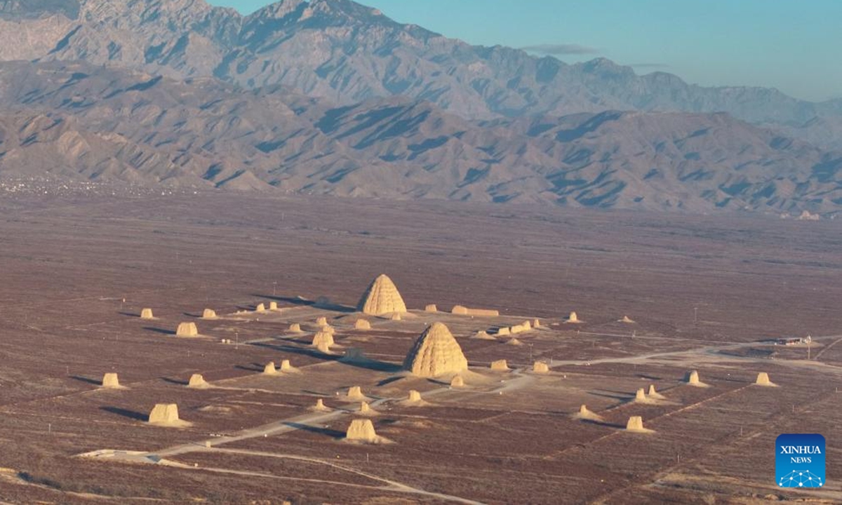 A drone photo taken on Dec. 28, 2025 shows a Xixia imperial tomb at sunrise in Yinchuan, northwest China's Ningxia Hui Autonomous Region. China's Xixia Imperial Tombs were officially added to the UNESCO World Heritage List on July 11, 2025 during the 47th session of the World Heritage Committee held in Paris, France. (Photo by Yuan Hongyan/Xinhua)