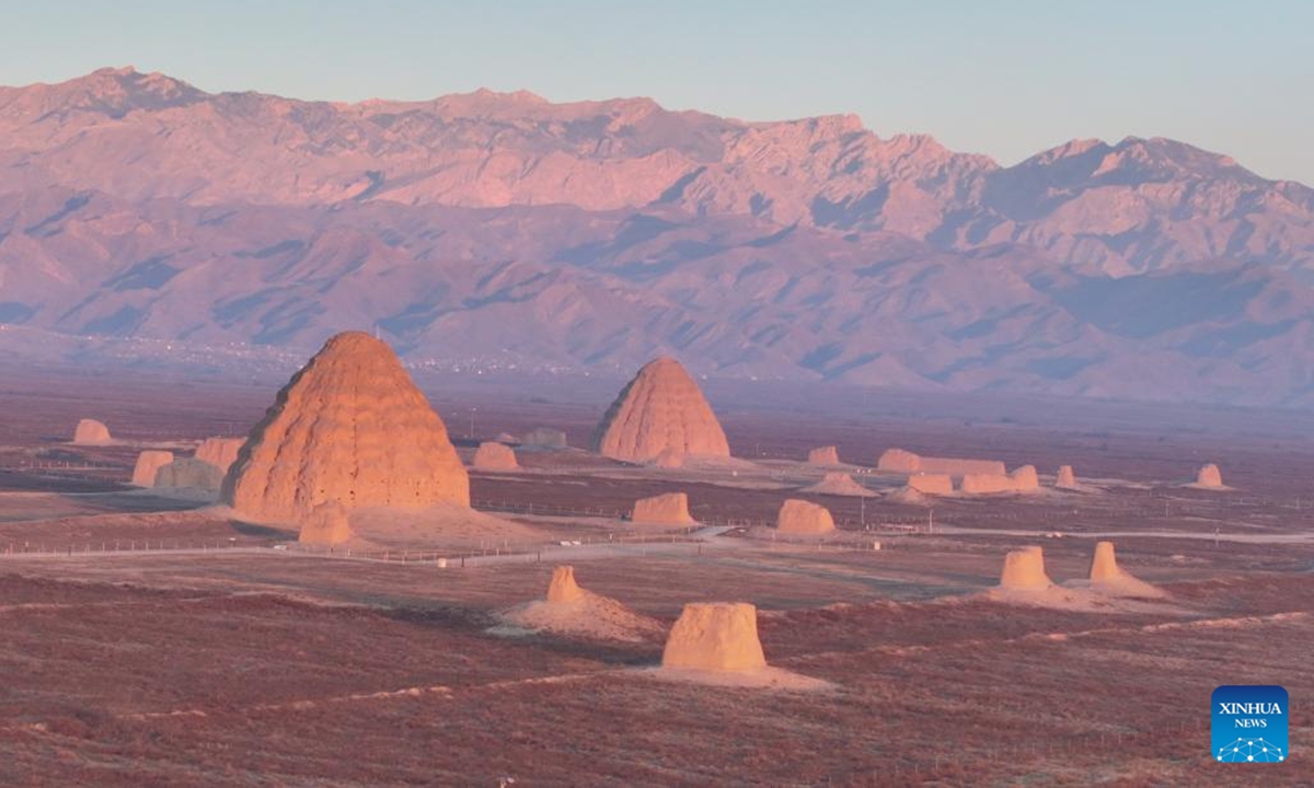A drone photo taken on Dec. 28, 2025 shows a Xixia imperial tomb at sunrise in Yinchuan, northwest China's Ningxia Hui Autonomous Region. China's Xixia Imperial Tombs were officially added to the UNESCO World Heritage List on July 11, 2025 during the 47th session of the World Heritage Committee held in Paris, France. (Photo by Yuan Hongyan/Xinhua)