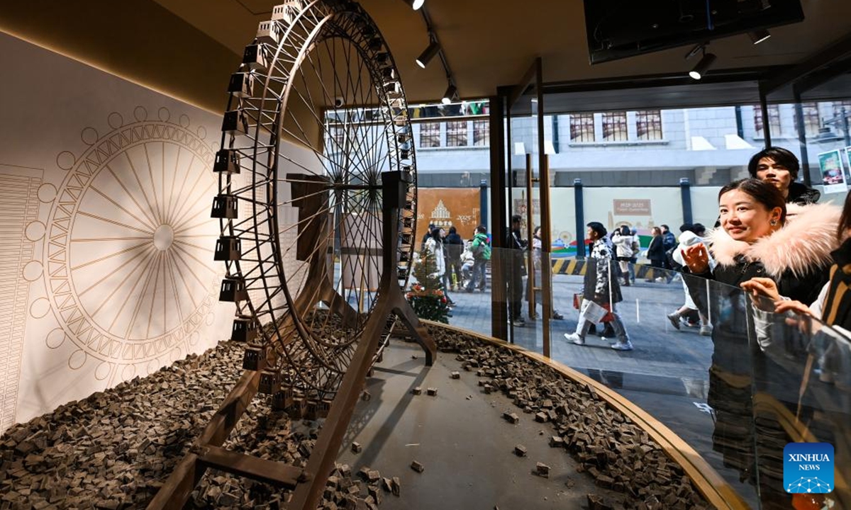 Tourists visit a chocolate museum in Tianjin, north China, Dec. 28, 2025. A chocolate museum has officially opened to the public in Tianjin. The museum displays more than 20 sets of handmade chocolate sculptures, with a total chocolate usage of nearly 10 tonnes. (Xinhua/Zhao Zishuo)