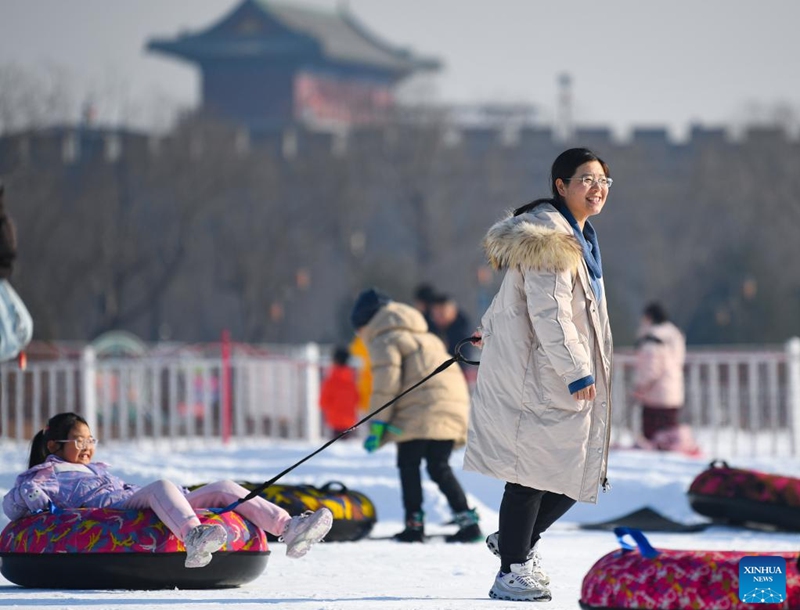 People play in an ice-and-snow theme park in Zhengding County of north China's Hebei Province, Dec. 28, 2025. (Photo by Zhang Xiaofeng/Xinhua)