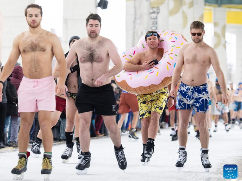 People wearing bathing suits participate in the 2025 Toronto Polar Bear Skate event in Toronto, Canada, on Dec. 28, 2025. About 160 skaters participated in this annual event to bid farewell to 2025 on Sunday. (Photo by Zou Zheng/Xinhua)