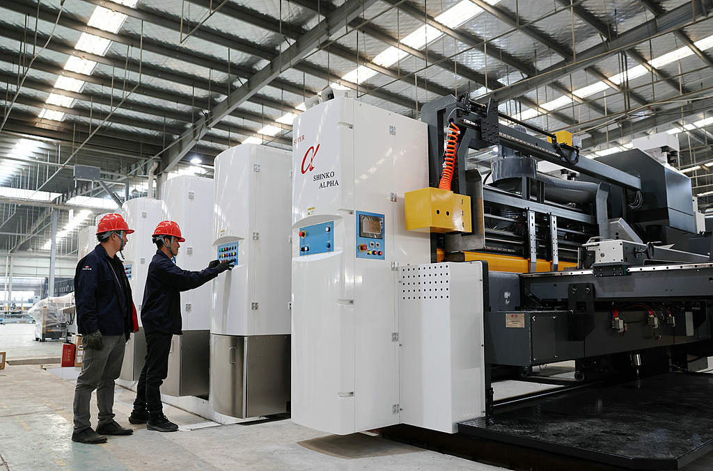 Technicians install equipment at a new materials manufacturer in Dongyang, East China's Zhejiang Province, on December 29, 2025. As the new year approaches, the company is adding a production line to boost output. Photo: VCG