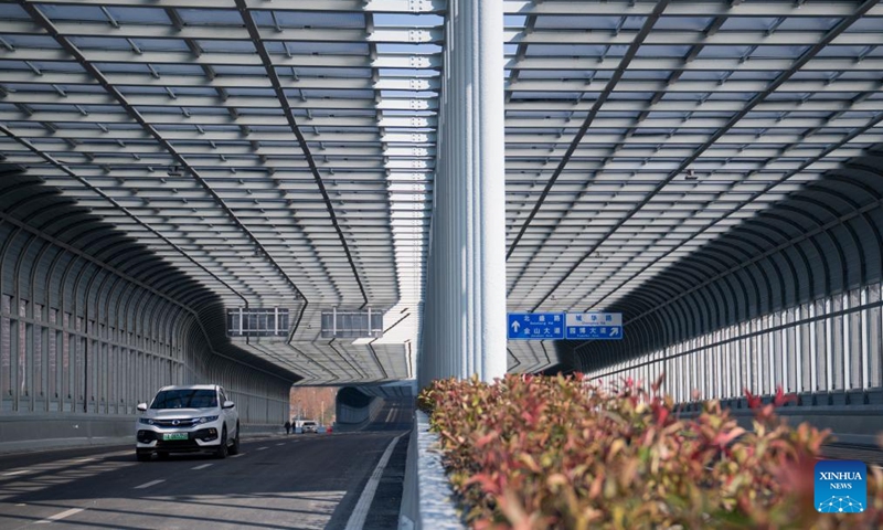 Vehicles run on the northern section of Gutian First Road in Wuhan, central China's Hubei Province, Dec. 28, 2025. The northern section of Gutian First Road in Wuhan was officially completed and opened to traffic on Sunday. The 2.78-kilometer road, crossing the Shanghai-Chongqing-Chengdu high-speed railway, Wuhan-Danjiangkou Railway, and Wuhan Third Ring Road, will benefit residents along the route. (Xinhua/Wu Zhizun)