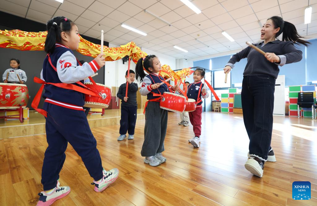 Children pratice playing waist drums in a kindergarten in Shijiazhuang City, north China's Hebei Province, Dec. 29, 2025. Various activities are held across China to celebrate the upcoming new year. (Photo by Liang Zidong/Xinhua)