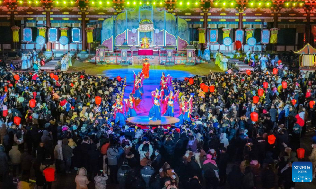 An aerial drone photo taken on Jan. 1, 2026 shows tourists watching a performance at the Laoling World Studios, a film and television shooting and cultural tourism base, in Laoling, east China's Shandong Province. China's economy kicked off 2026 with robust momentum, as evidenced by bustling economic activity in the year's first days. (Photo by Jia Peng/Xinhua)