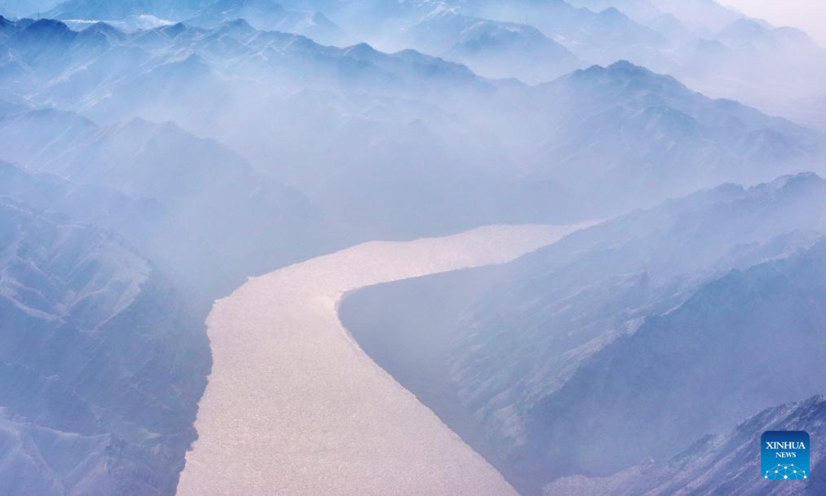 An aerial drone photo taken on Jan. 2, 2026 shows a view of the Yellow River after snowfall in Qingtongxia, northwest China's Ningxia Hui Autonomous Region. (Photo by Yuan Hongyan/Xinhua)