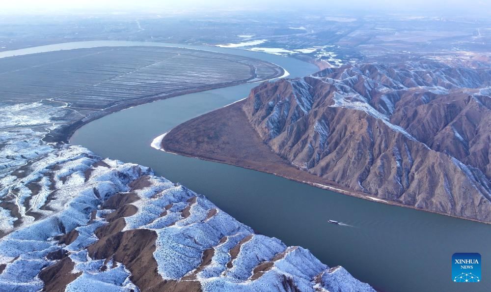 An aerial drone photo taken on Jan. 2, 2026 shows a view of the Yellow River after snowfall in Qingtongxia, northwest China's Ningxia Hui Autonomous Region. (Photo by Yuan Hongyan/Xinhua)