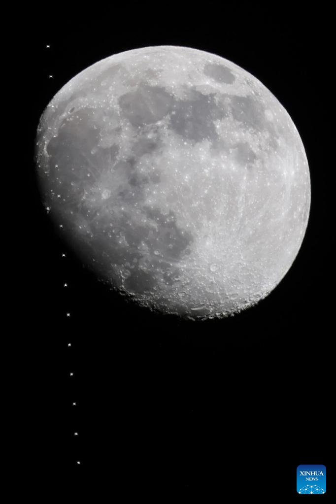 A stacked composite photo taken on Dec. 31, 2025 in Beijing, China shows the Chinese space station passing in front of the Moon. (Photo by Wang Zicheng/Xinhua)