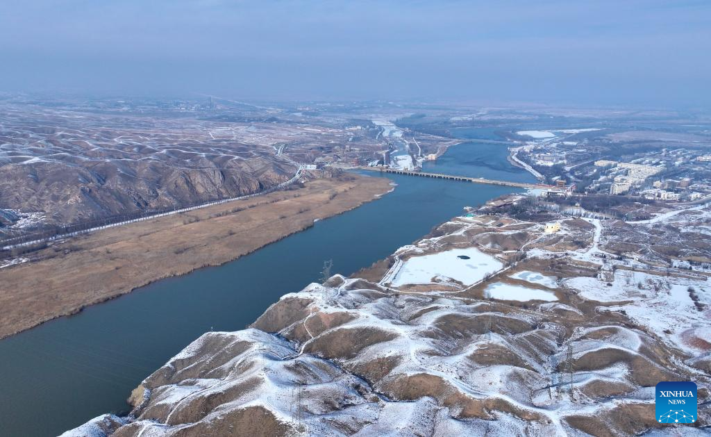An aerial drone photo taken on Jan. 2, 2026 shows a view of the Yellow River after snowfall in Qingtongxia, northwest China's Ningxia Hui Autonomous Region. (Photo by Yuan Hongyan/Xinhua)