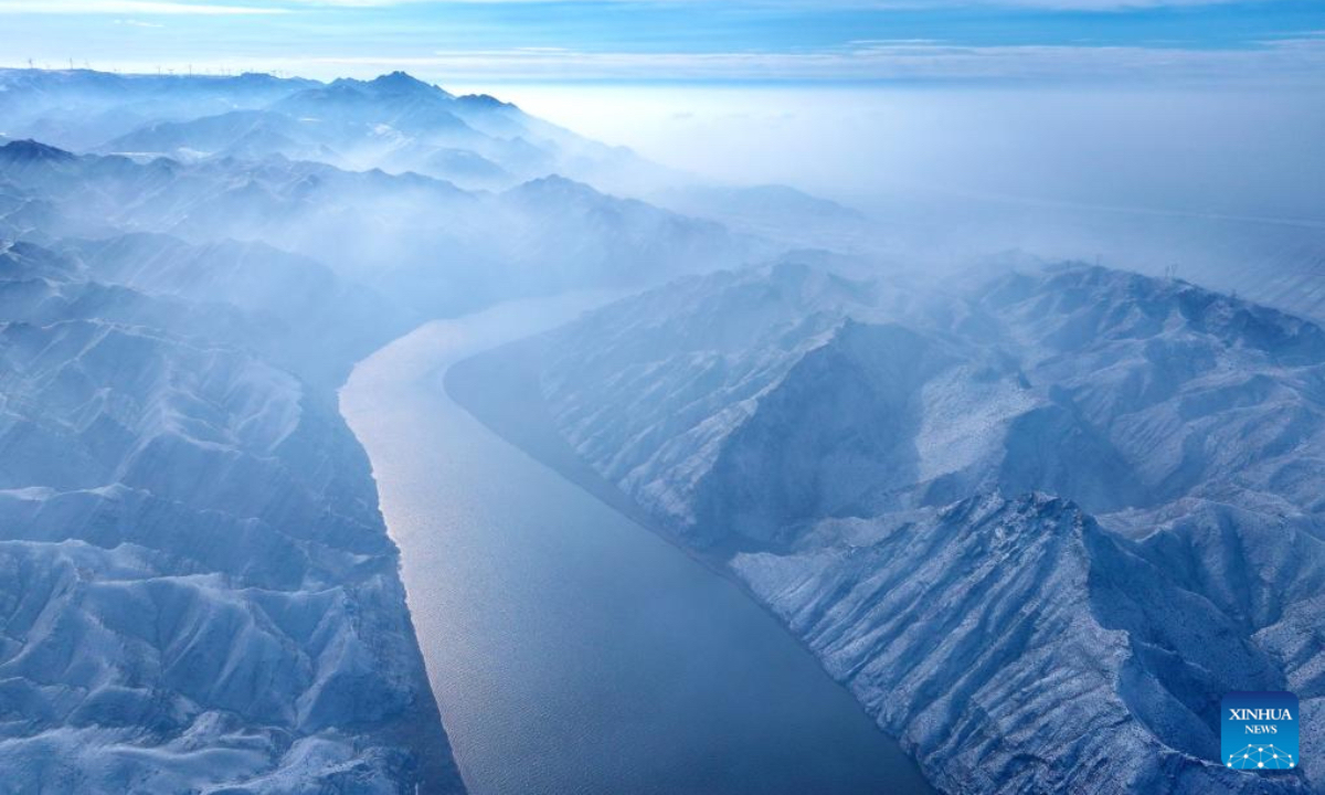 An aerial drone photo taken on Jan. 2, 2026 shows a view of the Yellow River after snowfall in Qingtongxia, northwest China's Ningxia Hui Autonomous Region. (Photo by Yuan Hongyan/Xinhua)