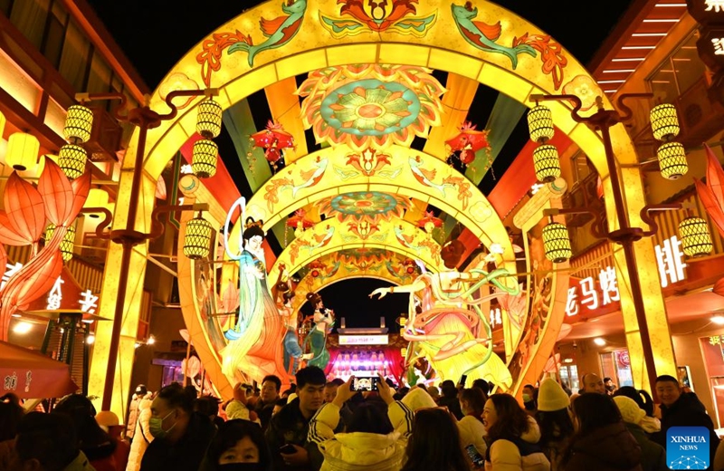 Tourists visit a lantern fair at a night market in Dunhuang, northwest China's Gansu Province, Dec. 31, 2025. The lantern fair kicked off here on Wednesday, attracting many tourists to experience the unique charm of Dunhuang. (Photo by Zhang Xiaoliang/Xinhua)