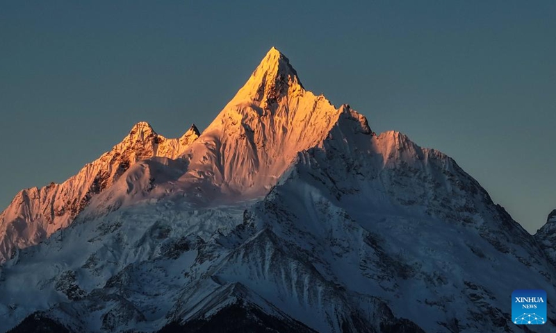 This photo taken on Jan. 1, 2026 shows sunlight shining on the Meili Snow Mountain in Deqen County, southwest China's Yunnan Province. People across China welcome the arrival of 2026 at sunrise. (Photo by Li Chunlei/Xinhua)